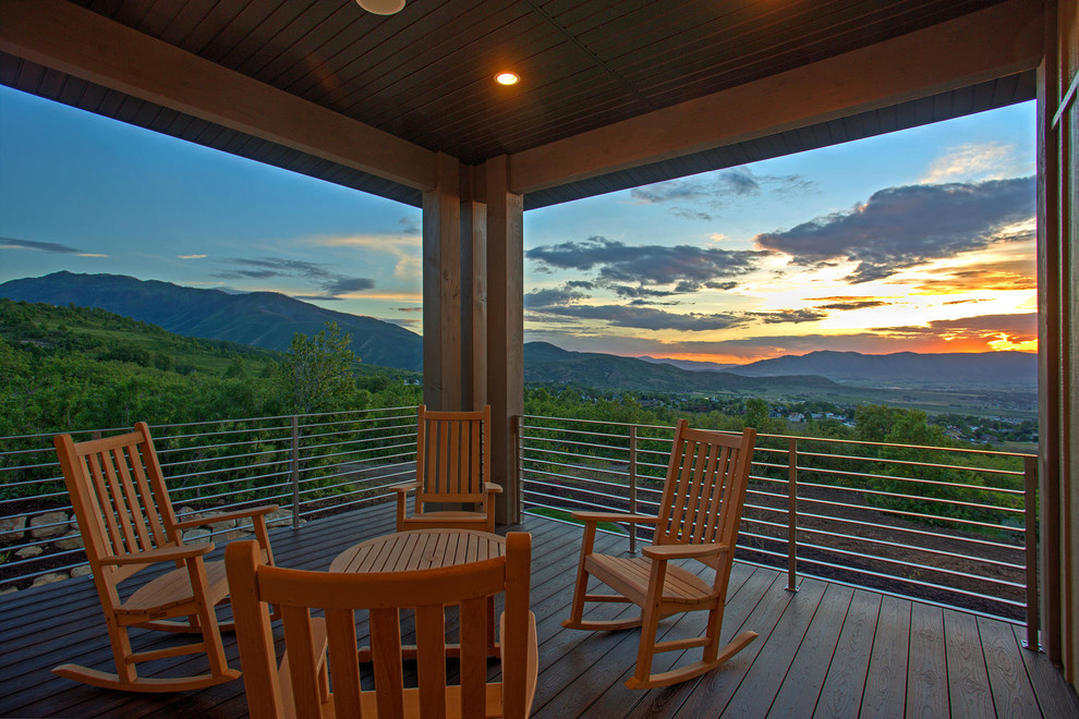 This is an example of a mid-sized country balcony in Salt Lake City with a roof extension.