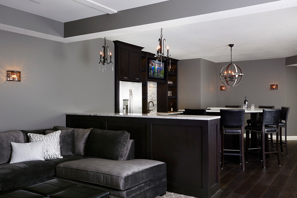 Design ideas for a large transitional fully buried basement in Minneapolis with grey walls and dark hardwood floors.
