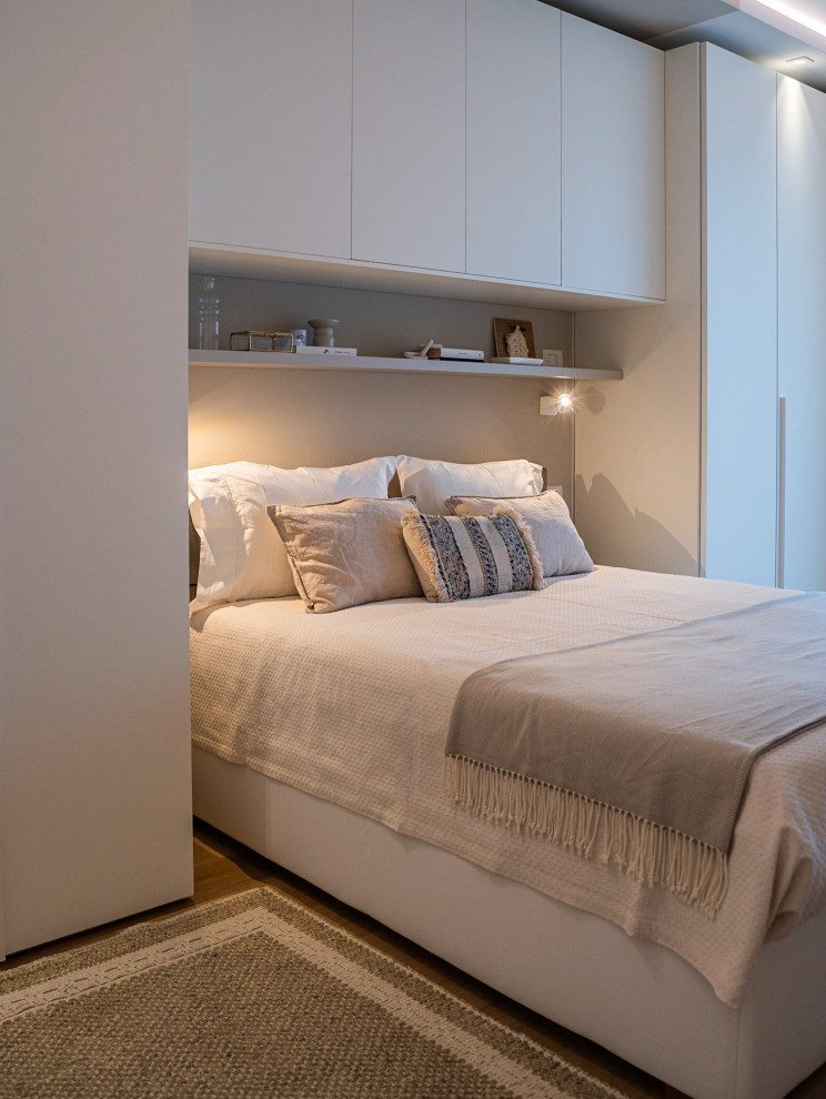 Bedroom - mid-sized contemporary master light wood floor bedroom idea in Milan with gray walls