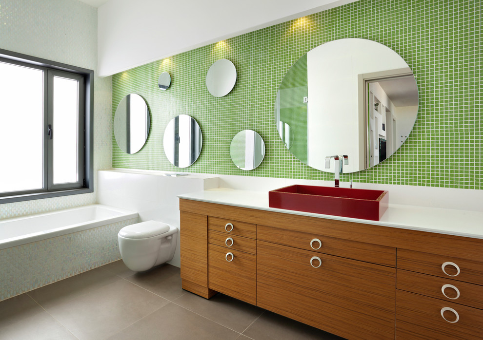 Inspiration for a contemporary bathroom in Tel Aviv with a vessel sink, green walls, brown floor and white benchtops.