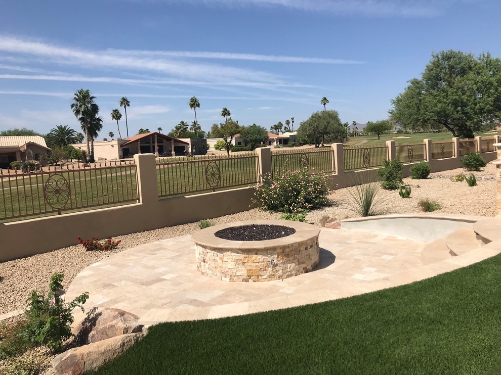 Design ideas for a large traditional backyard full sun xeriscape in Phoenix with a fire feature and natural stone pavers.