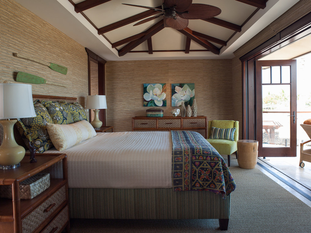 Photo of a mid-sized tropical bedroom in Hawaii with brown walls.