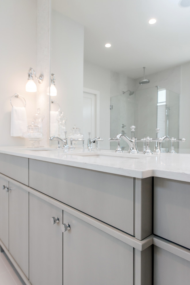 Freestanding bathtub - large transitional master multicolored tile and ceramic tile ceramic tile freestanding bathtub idea in Calgary with an undermount sink, flat-panel cabinets, gray cabinets, quartz countertops and white walls