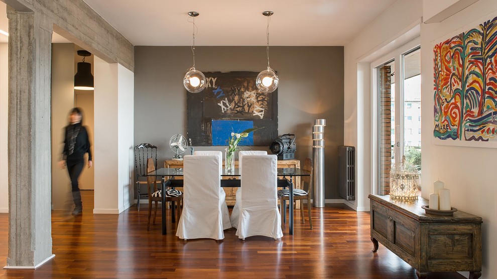 Design ideas for a large contemporary open plan dining in Rome with grey walls and dark hardwood floors.