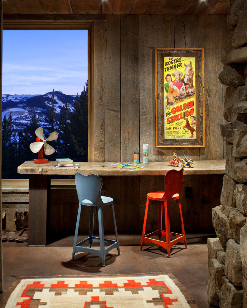 Mountain Ski Lodge - Inspiration for a mid-sized rustic gender-neutral concrete floor and brown floor playroom remodel with brown walls