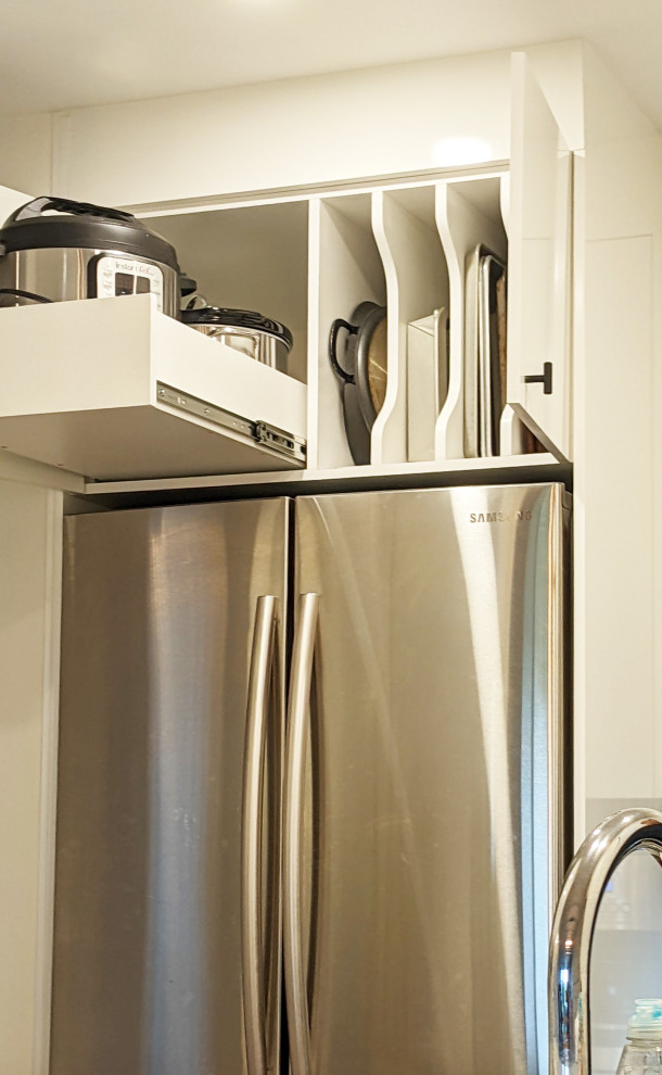 Photo of a small contemporary galley enclosed kitchen in Montreal with a submerged sink, flat-panel cabinets, engineered stone countertops, white splashback, mosaic tiled splashback, stainless steel appliances, porcelain flooring, no island, grey floors and white worktops.