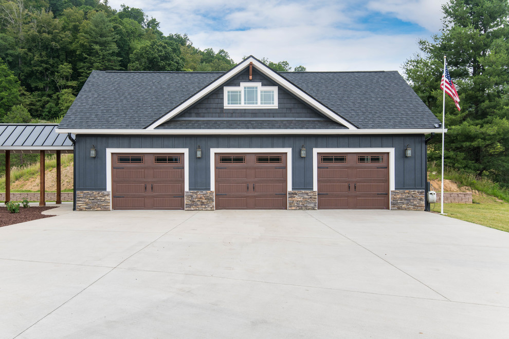 This is an example of a large arts and crafts detached three-car garage in Other.