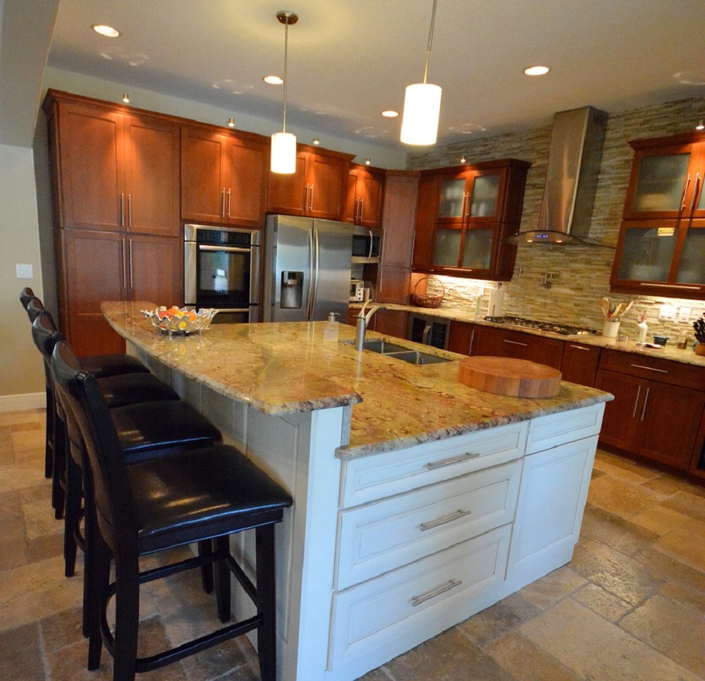 Arts and crafts l-shaped open plan kitchen in Orlando with an undermount sink, glass-front cabinets, medium wood cabinets, granite benchtops, stone tile splashback, stainless steel appliances, porcelain floors and with island.