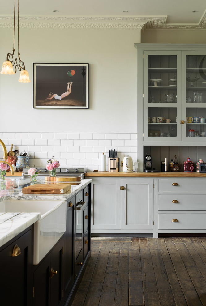 Photo of a large eclectic kitchen in Other with a farmhouse sink, shaker cabinets, grey cabinets and with island.