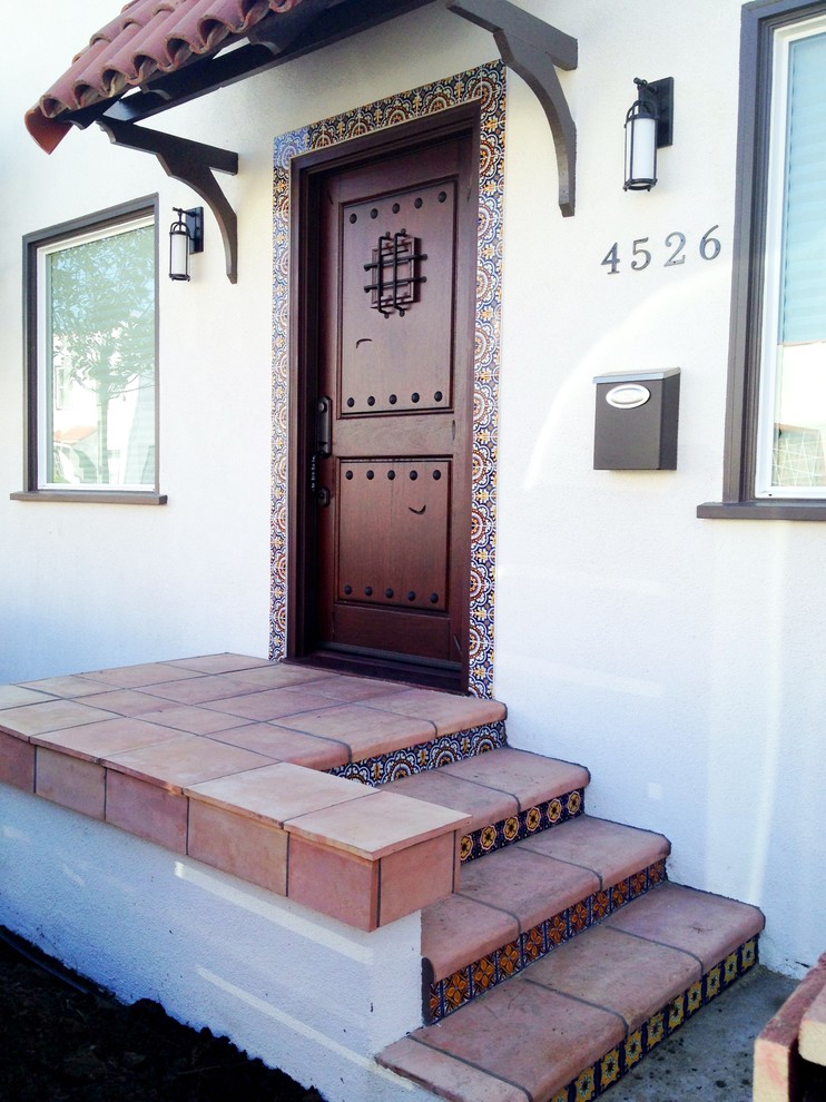 Tuscan white one-story stucco exterior home photo in Los Angeles