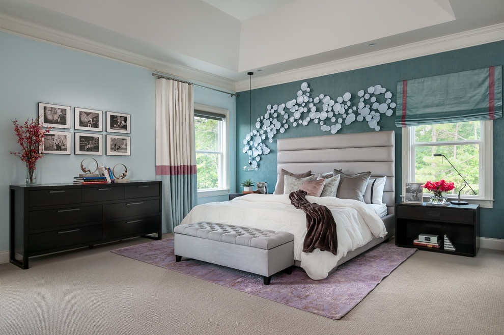 Photo of a large modern master bedroom in Atlanta with blue walls, carpet and beige floor.