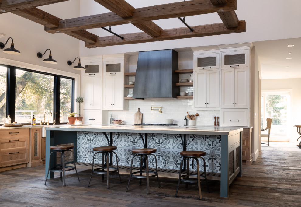 This is an example of a large rural l-shaped kitchen in San Francisco with shaker cabinets, concrete worktops, white splashback, porcelain splashback, an island, grey worktops, white cabinets, dark hardwood flooring and exposed beams.