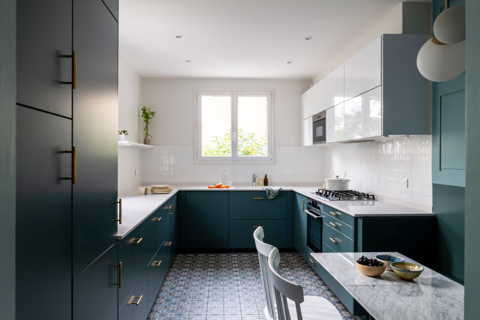 Photo of a large contemporary u-shaped separate kitchen in Paris with beaded inset cabinets, blue cabinets, quartz benchtops and white benchtop.