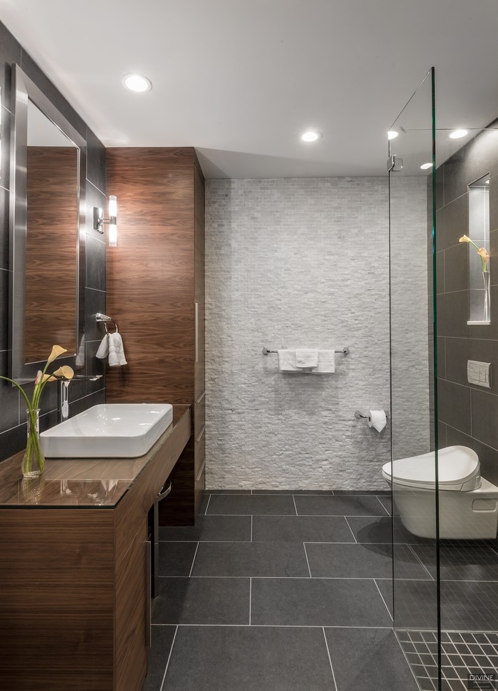 This is an example of a mid-sized modern 3/4 bathroom in Boston with flat-panel cabinets, white cabinets, a curbless shower, a one-piece toilet, blue tile, glass tile, blue walls, slate floors, an undermount sink, engineered quartz benchtops, multi-coloured floor, a hinged shower door and grey benchtops.