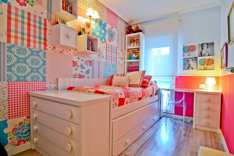 Inspiration for a mid-sized transitional kids' bedroom for kids 4-10 years old and girls in Other with multi-coloured walls, light hardwood floors and beige floor.