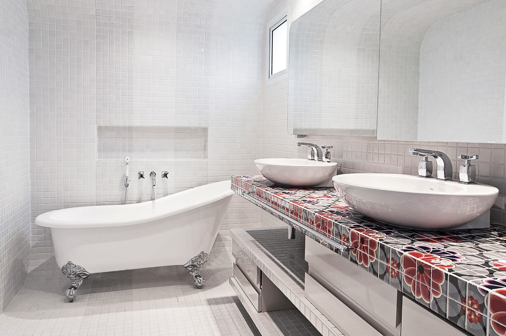 Inspiration for a transitional bathroom in Miami with flat-panel cabinets, white cabinets, a claw-foot tub, multi-coloured tile, a vessel sink and tile benchtops.