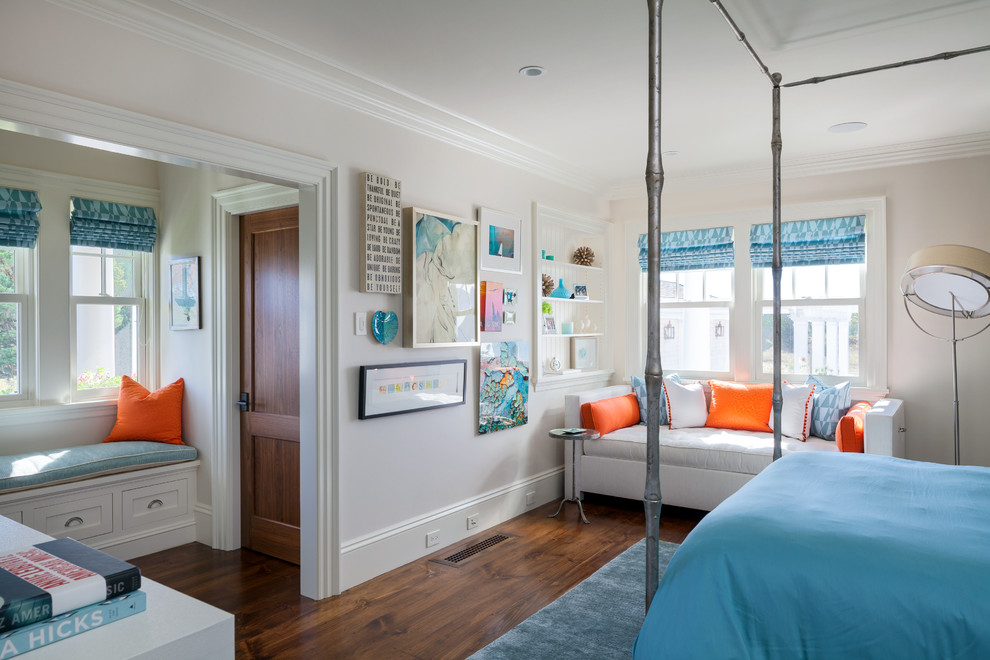 Design ideas for a large beach style bedroom in Boston with white walls and medium hardwood floors.