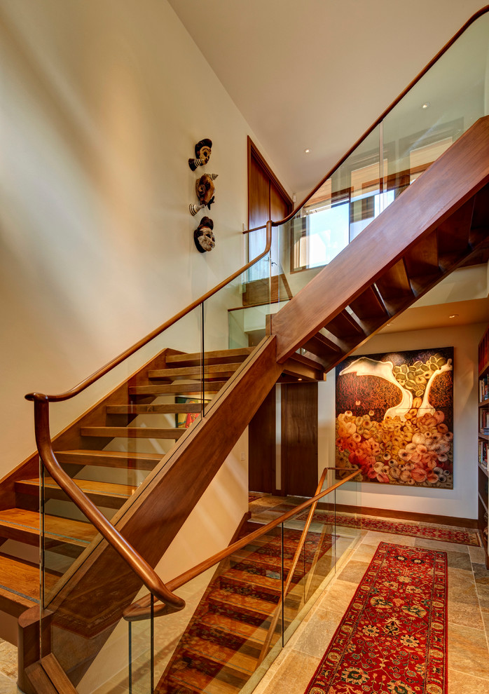 Design ideas for a large transitional wood l-shaped staircase in Detroit with open risers.