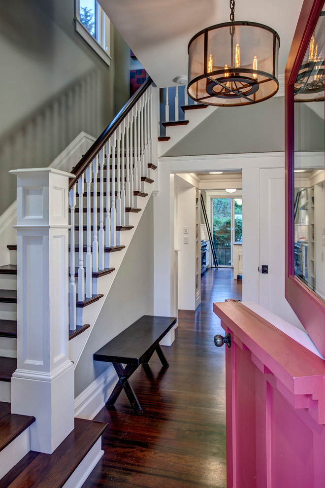 This is an example of a mid-sized traditional foyer in Seattle with grey walls, dark hardwood floors, a dutch front door and a purple front door.