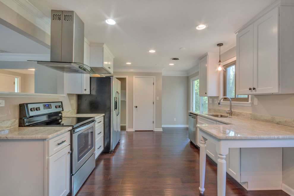 Inspiration for a large contemporary galley dark wood floor and brown floor open concept kitchen remodel in Richmond with an undermount sink, shaker cabinets, white cabinets, quartzite countertops, stainless steel appliances and a peninsula