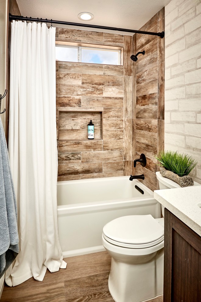 Mid-sized mountain style kids' white tile and subway tile porcelain tile and brown floor alcove bathtub photo in Denver with shaker cabinets, distressed cabinets, a one-piece toilet, white walls, an undermount sink, quartz countertops and white countertops