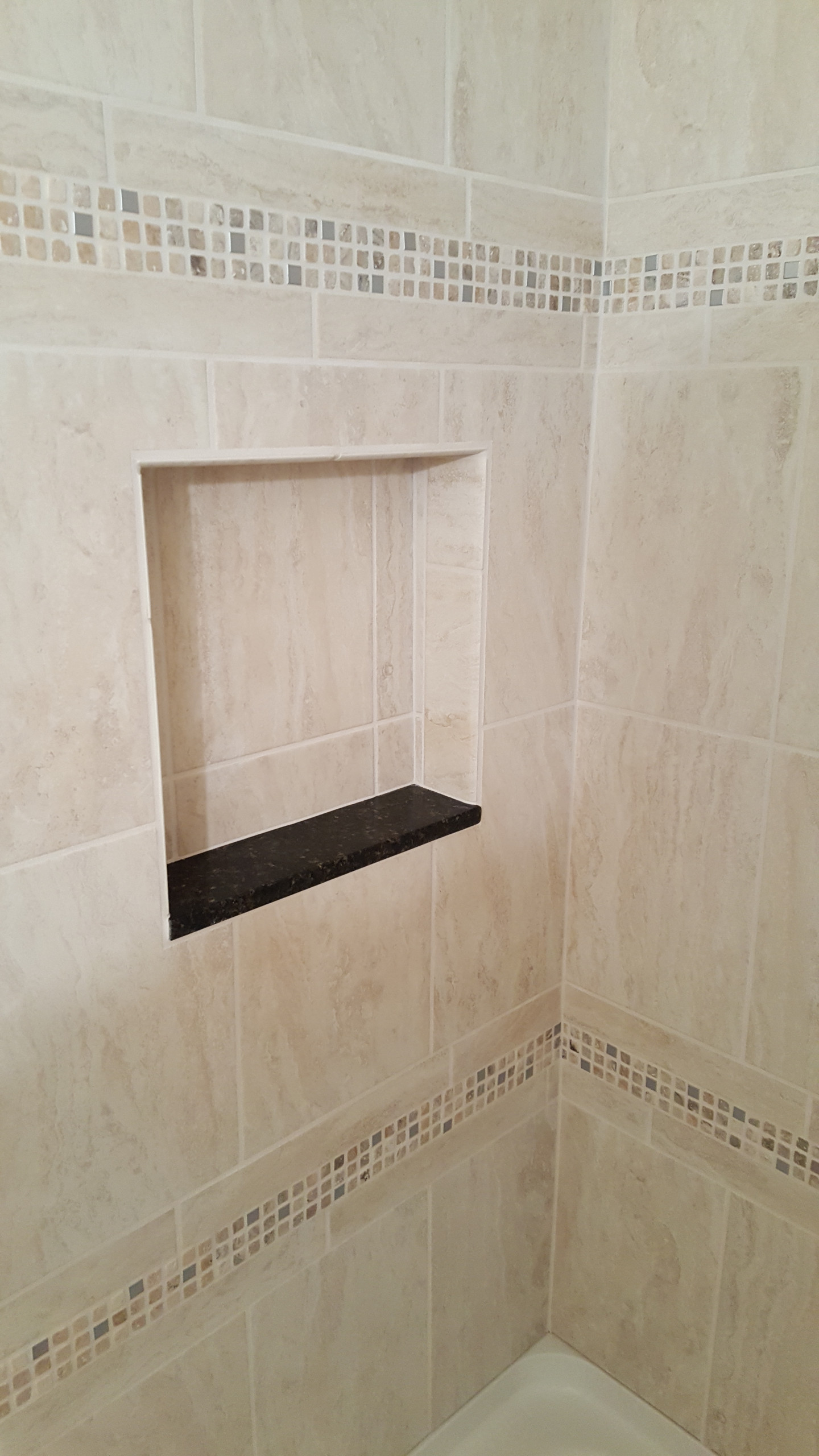 Shampoo shelf with granite sill that will match vanity top
