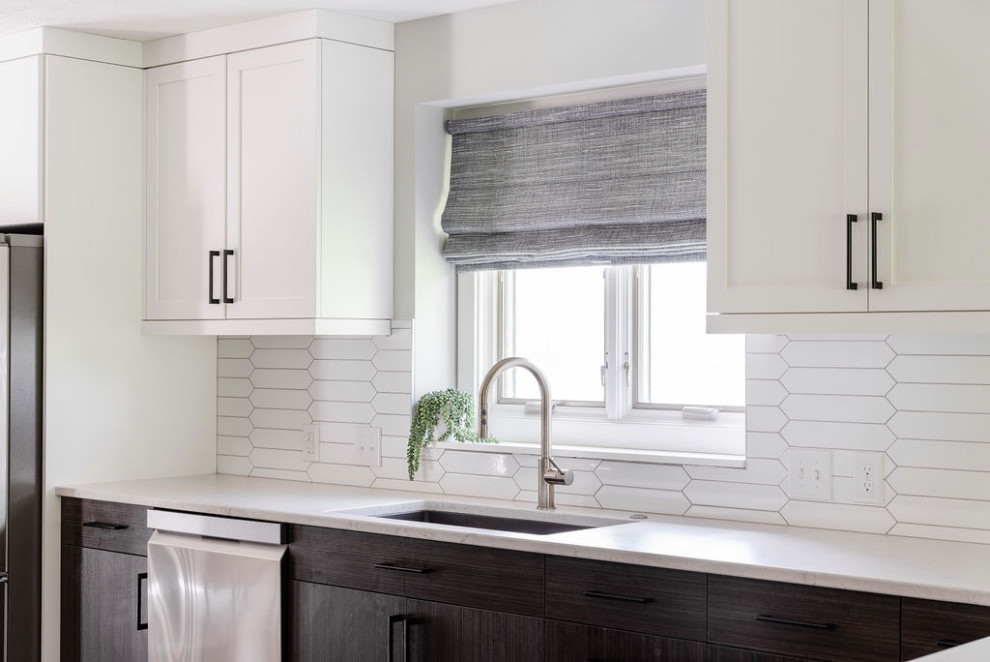 Example of a mid-sized minimalist eat-in kitchen design in Omaha with quartzite countertops, white backsplash, no island and white countertops