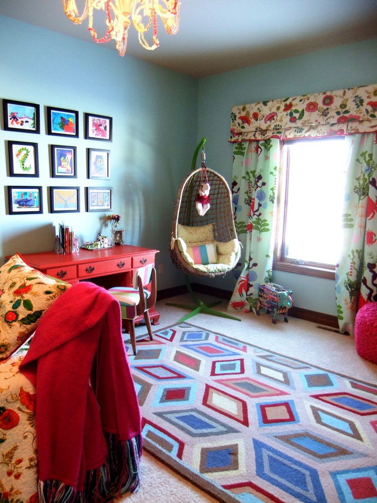 This is an example of an eclectic gender-neutral kids' study room for kids 4-10 years old in Minneapolis with blue walls and carpet.