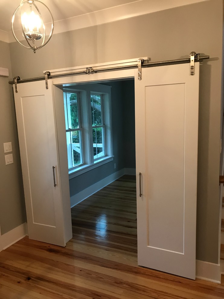 Mid-sized beach style medium tone wood floor entryway photo in Charleston with green walls