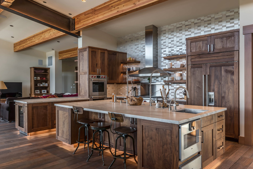 Inspiration for a country l-shaped kitchen in Other with an undermount sink, shaker cabinets, dark wood cabinets, multi-coloured splashback, panelled appliances, dark hardwood floors and with island.