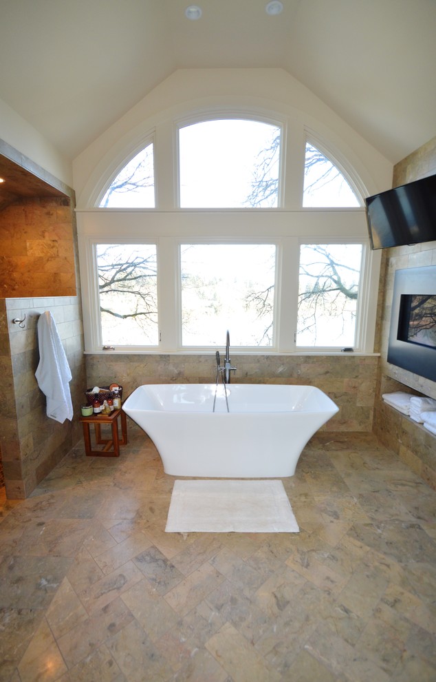 Large transitional master bathroom in Portland with a pedestal sink, a freestanding tub, a curbless shower, beige tile, stone tile, yellow walls and marble floors.