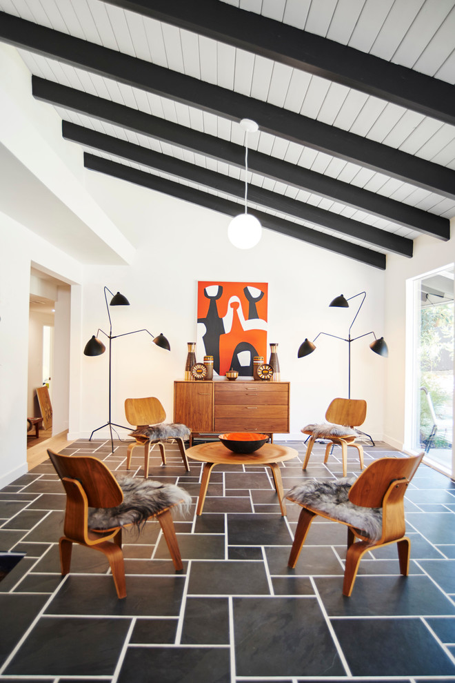 This is an example of a mid-sized midcentury living room in Los Angeles with white walls.