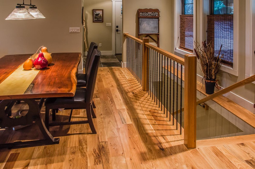 Inspiration for a mid-sized transitional wooden medium tone wood floor and brown floor great room remodel with wooden risers and beige walls