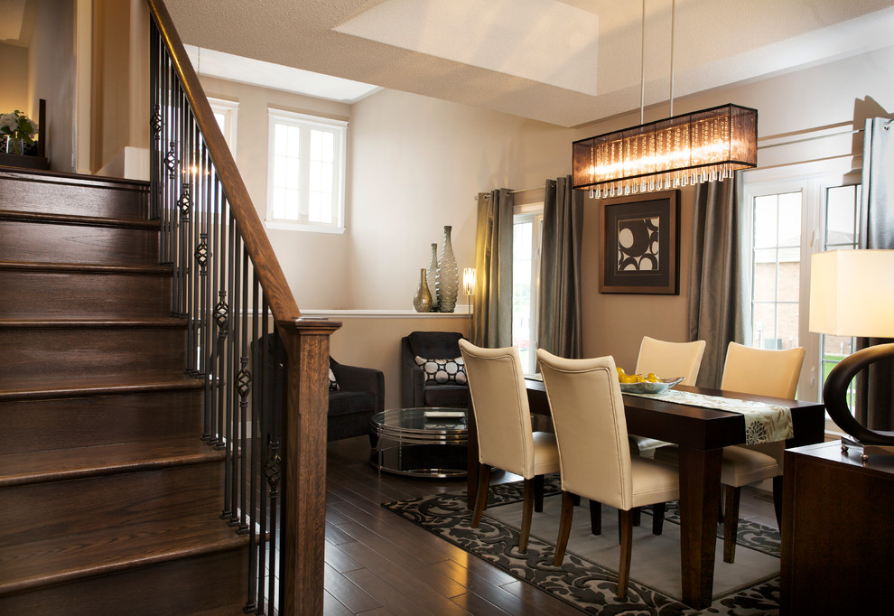 This is an example of a contemporary dining room in Toronto with dark hardwood floors.