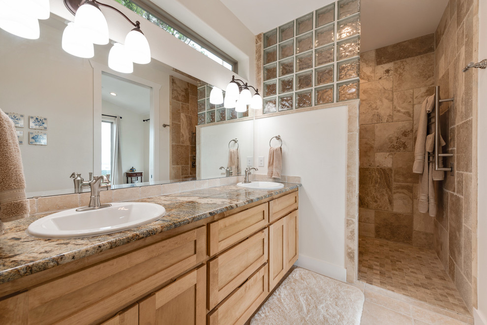 Inspiration for a mid-sized traditional master bathroom in Austin with shaker cabinets, light wood cabinets, an alcove shower, travertine, beige walls, travertine floors, a drop-in sink, granite benchtops, beige floor and an open shower.