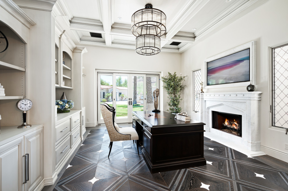 Inspiration for a modern study in Phoenix with a standard fireplace, a stone fireplace surround, a freestanding desk and a coffered ceiling.