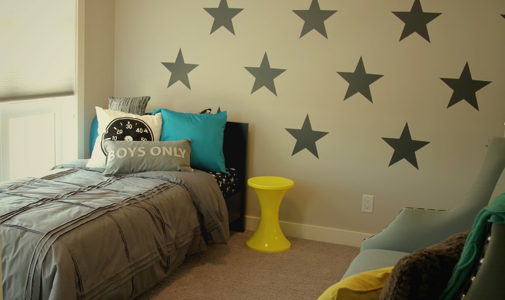 This is an example of a modern kids' bedroom for kids 4-10 years old and boys in Calgary with grey walls and carpet.