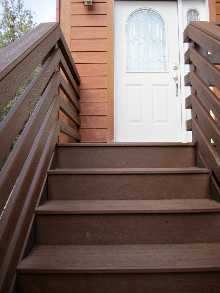 Example of a small transitional entryway design in Denver with orange walls