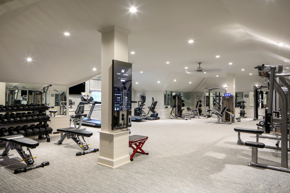 Photo of an expansive transitional multipurpose gym in New Orleans with white walls, carpet and grey floor.