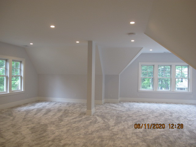 Example of a transitional home design design in Boston