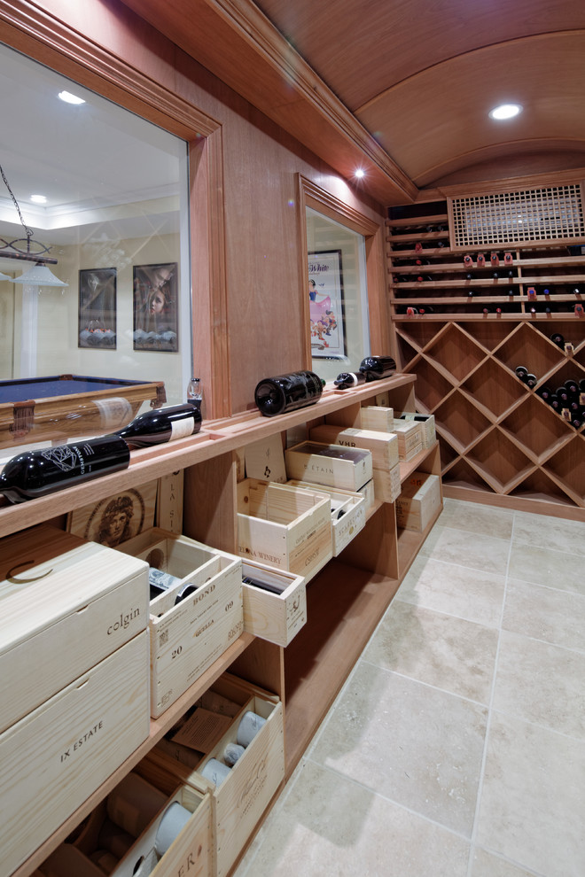 Photo of a mid-sized mediterranean wine cellar in New York with porcelain floors.