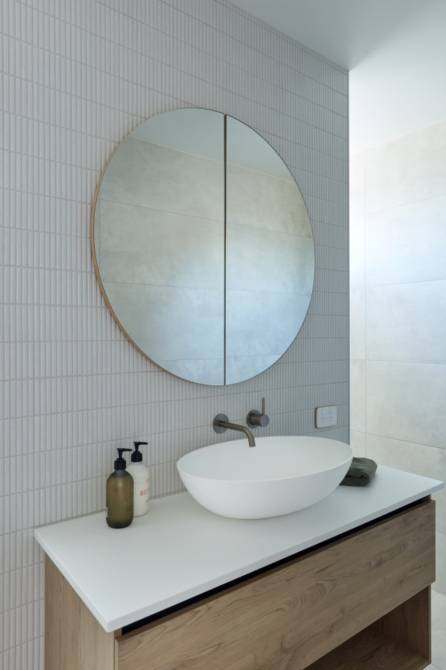 Small beach style master gray tile and mosaic tile ceramic tile and single-sink bathroom photo in Other with a one-piece toilet, gray walls, a vessel sink, white countertops and a floating vanity