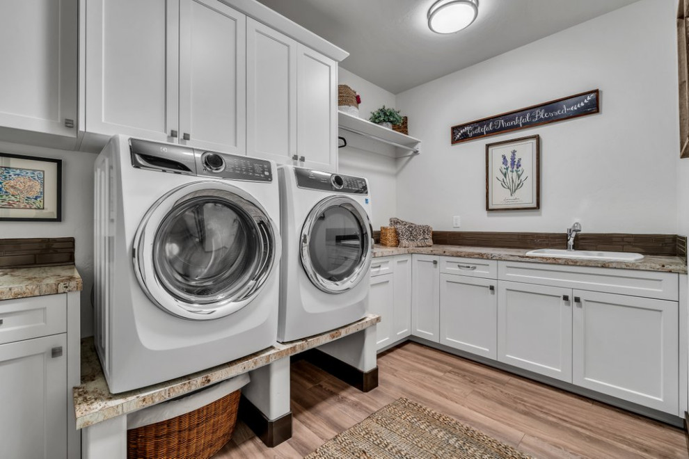 Laundry room - rustic laundry room idea in Seattle