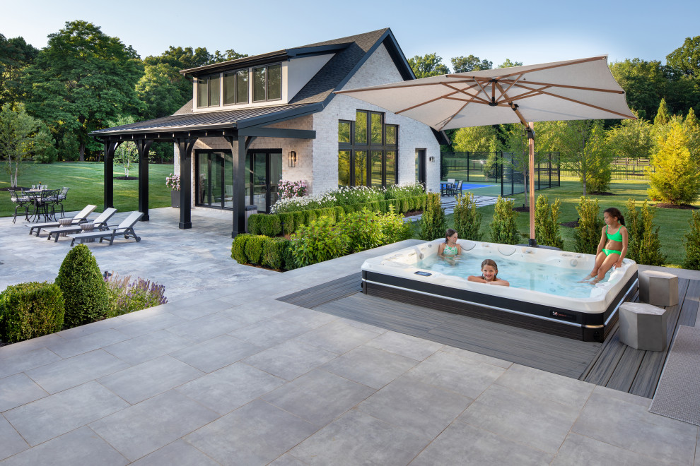 Inspiration for a transitional backyard hot tub remodel in DC Metro
