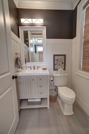 This is an example of a large contemporary powder room in Detroit.