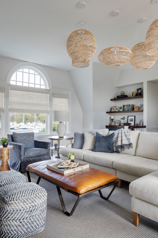 Example of a beach style living room design in Portland Maine