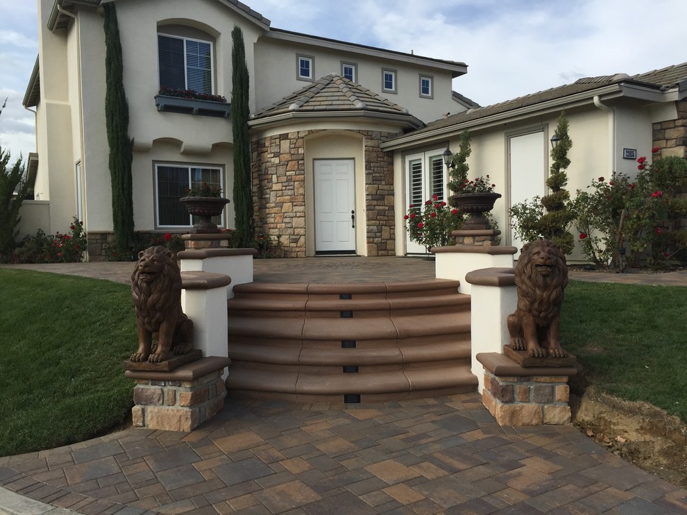 Example of a huge transitional front door design in Orange County with a white front door