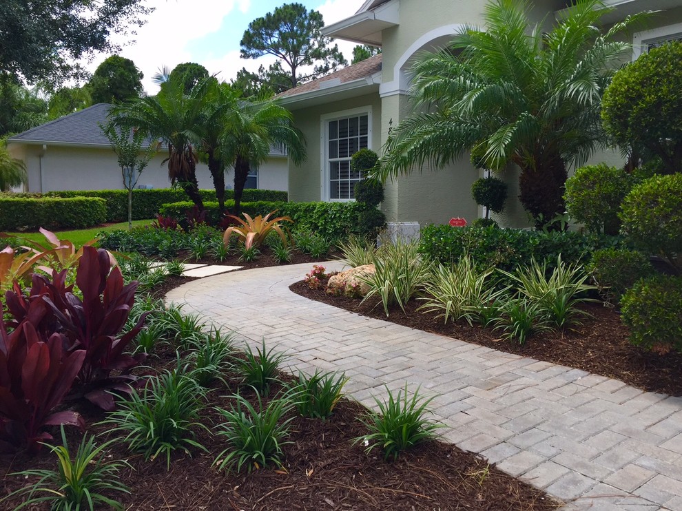 Photo of a tropical home design in Orlando.