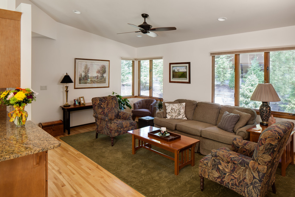 This is an example of a midcentury family room in Milwaukee.