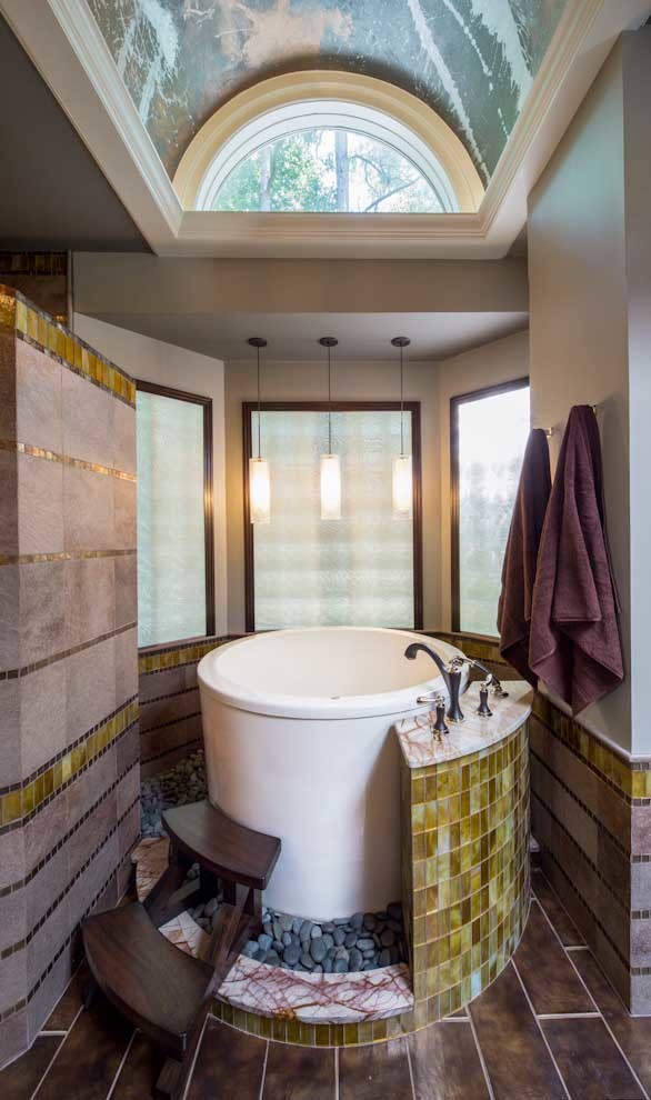 Inspiration for a large contemporary master bathroom in Houston with a vessel sink, flat-panel cabinets, dark wood cabinets, granite benchtops, a japanese tub, an alcove shower, a one-piece toilet, brown tile, porcelain tile, white walls and porcelain floors.